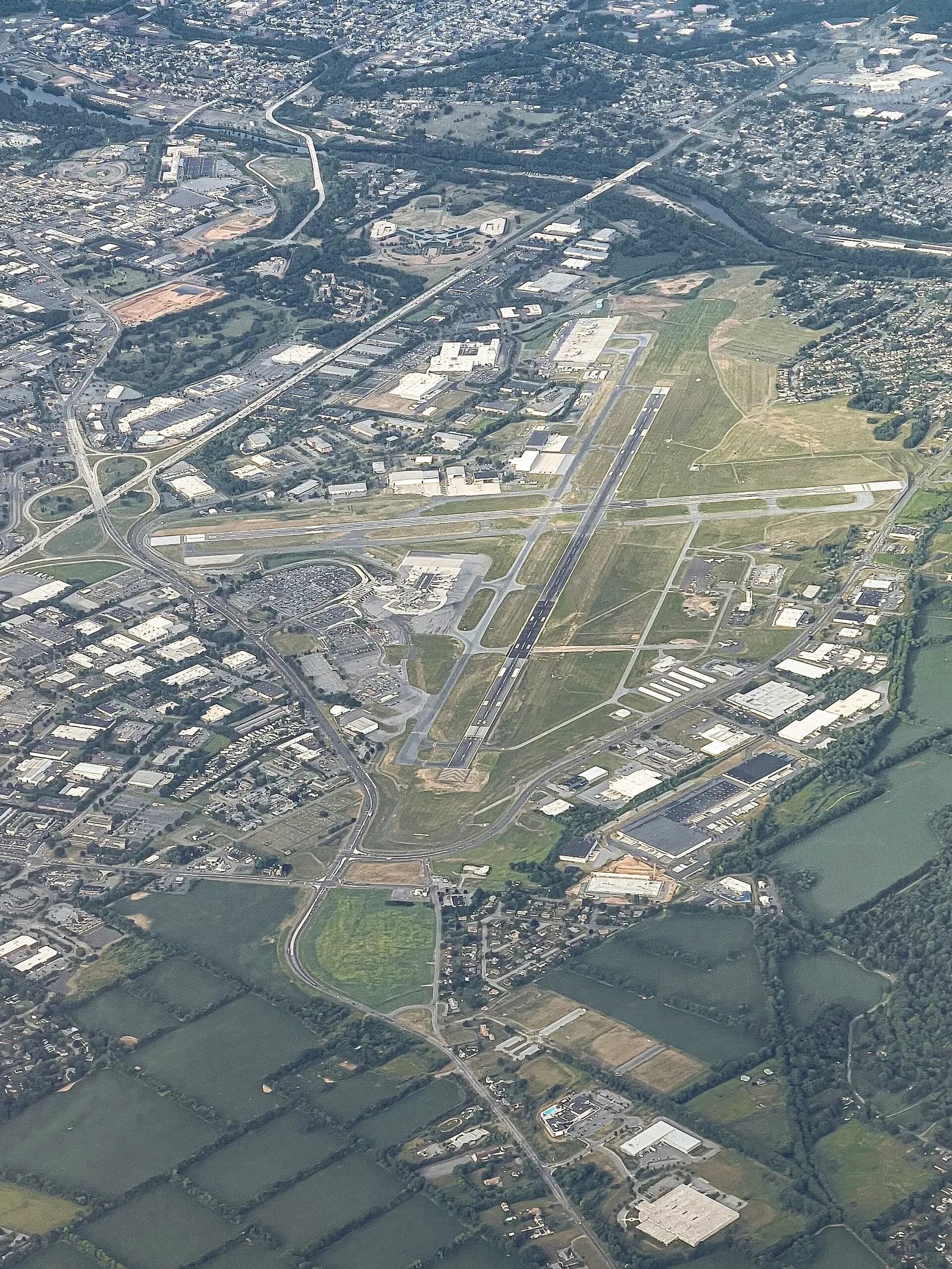 Aerial view of Lehigh Valley International Airport looking across the civil terminal, apron, and intersecting runways in Hanover Township.