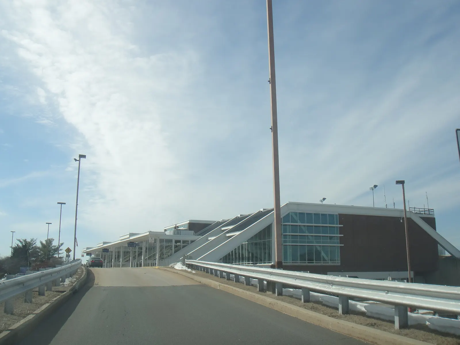 Main terminal exterior at Lehigh Valley International Airport with the glass curtain wall and roadway in March 2014.
