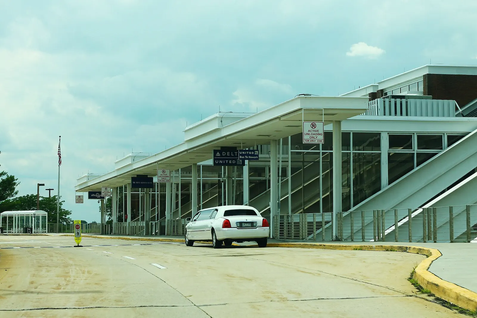 Upper-level ticketing curb at Lehigh Valley International Airport with glass facade and roadway canopy.