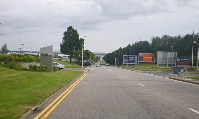 Main access road leading toward Aberdeen Airport’s principal terminal area.
