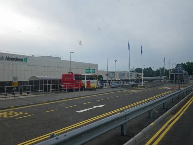 Front façade of Aberdeen Airport’s main passenger terminal with glazed frontage and forecourt.