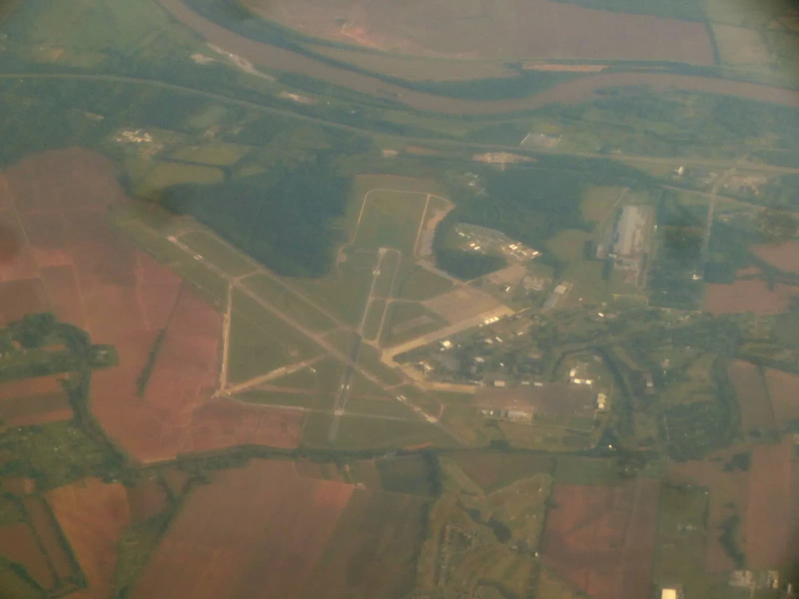 Aerial view of the two crossing runways and former England Air Force Base campus at Alexandria International Airport.