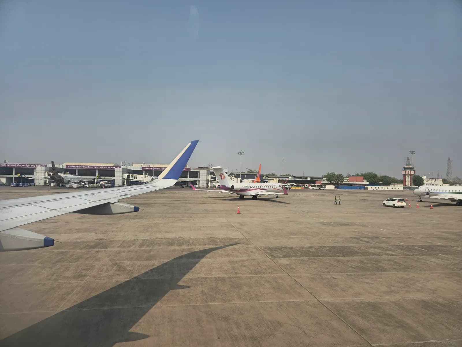 Apron and terminal buildings at Ahmedabad airport with Star Air regional jet
