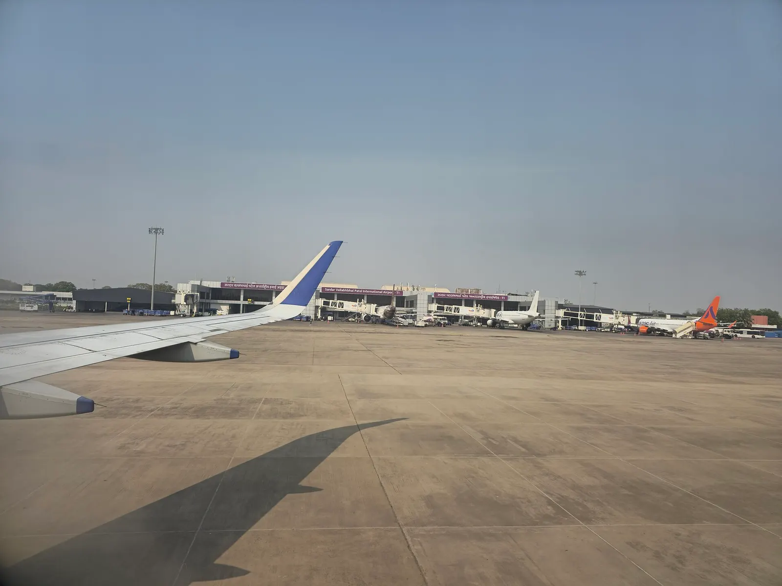Terminal 1 airside at Sardar Vallabhbhai Patel International Airport with jet bridges and parked aircraft