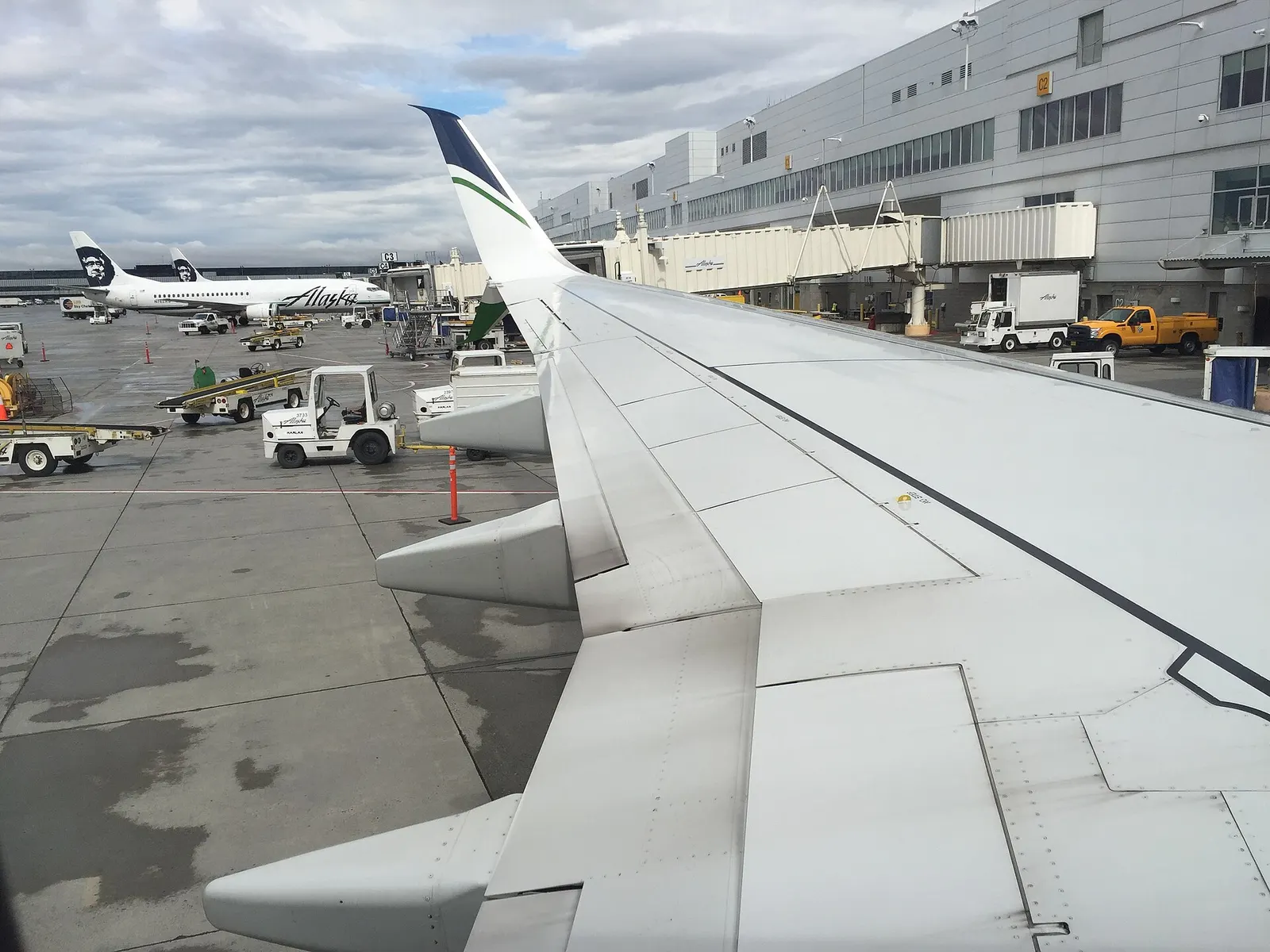 Alaska Airlines aircraft at Concourse C of the South Terminal, Ted Stevens Anchorage International Airport, Alaska, USA. Viewed from a Boeing 737-900ER registered N481AS.