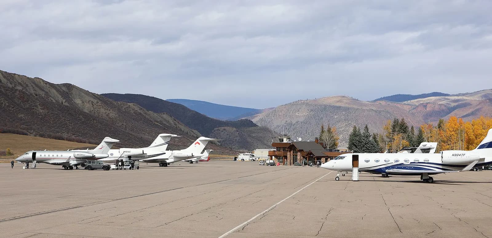 Regional jets and general-aviation aircraft on the Aspen/Pitkin County Airport apron in October 2025.