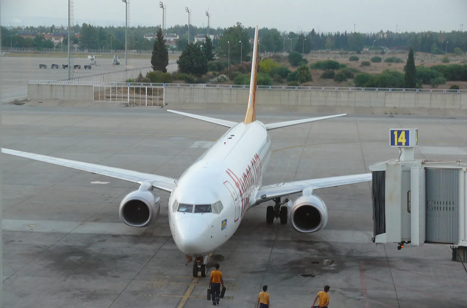 Pegasus Airlines Boeing 737 at Antalya gate 14 with jet bridge and ground crew