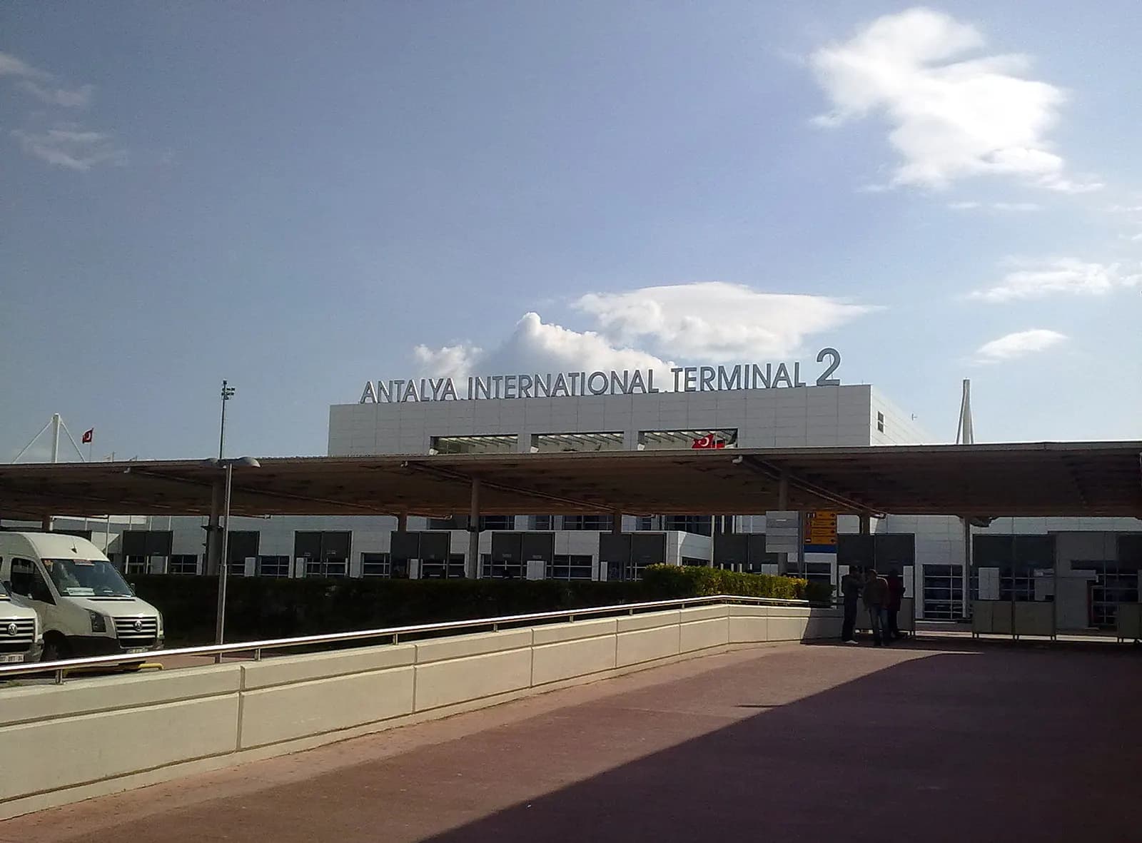 Exterior of Antalya International Terminal 2 with rooftop lettering and curb canopy