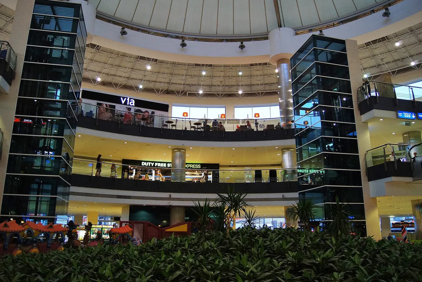 Duty-free and café atrium with glass elevators inside Antalya Terminal 2