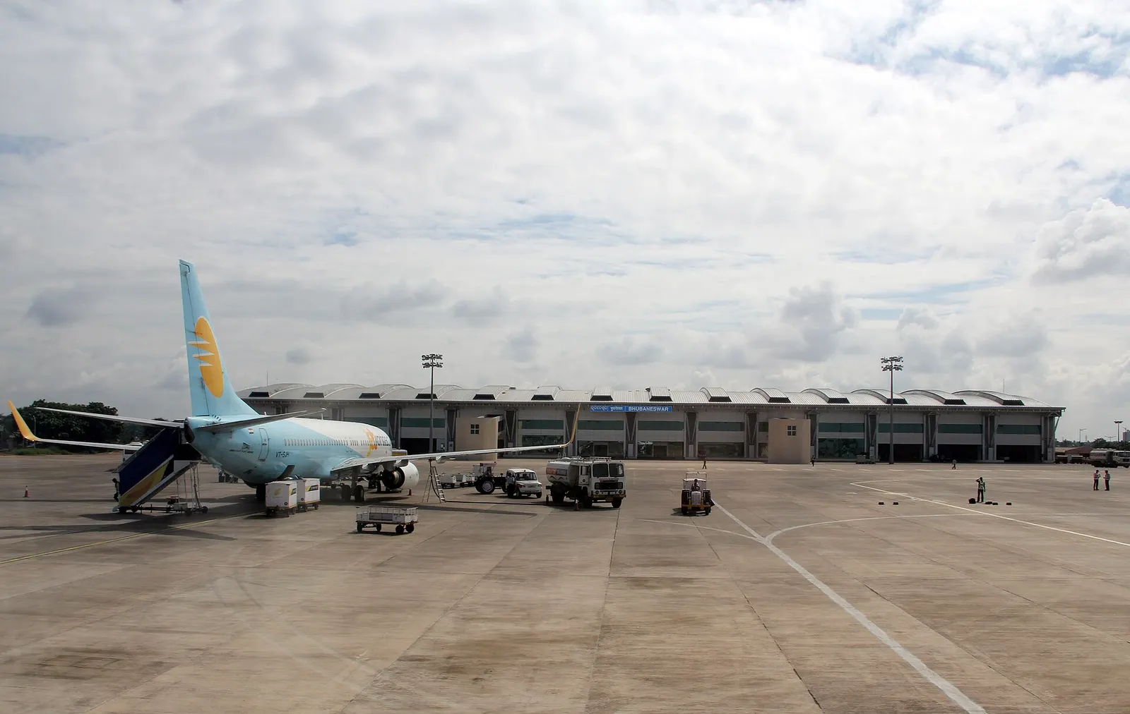 Apron view toward Bhubaneswar terminal with JetKonnect aircraft and BHUBANESWAR roof signage
