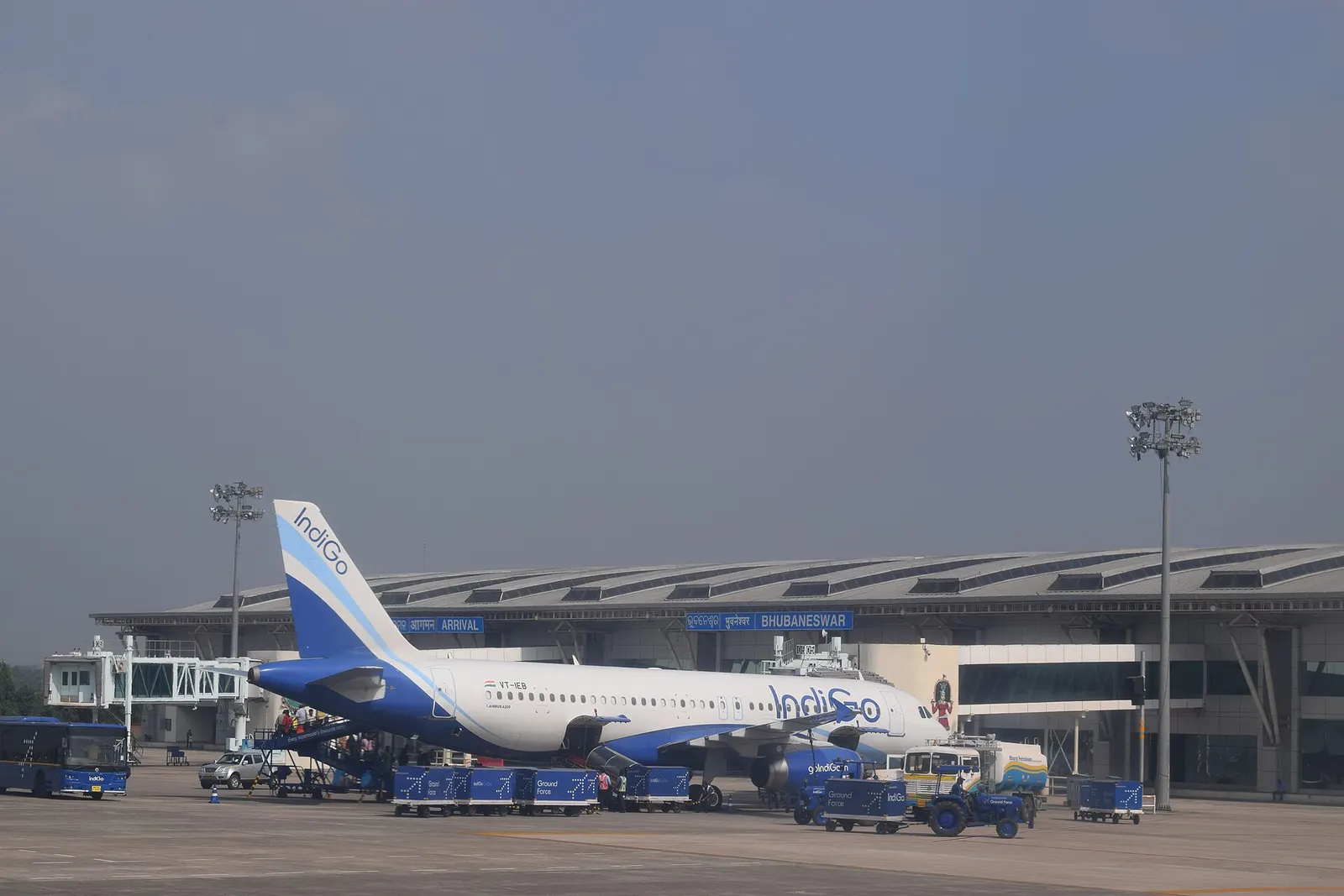 IndiGo A320 on the apron in front of the BHUBANESWAR arrivals facade at Biju Patnaik Airport