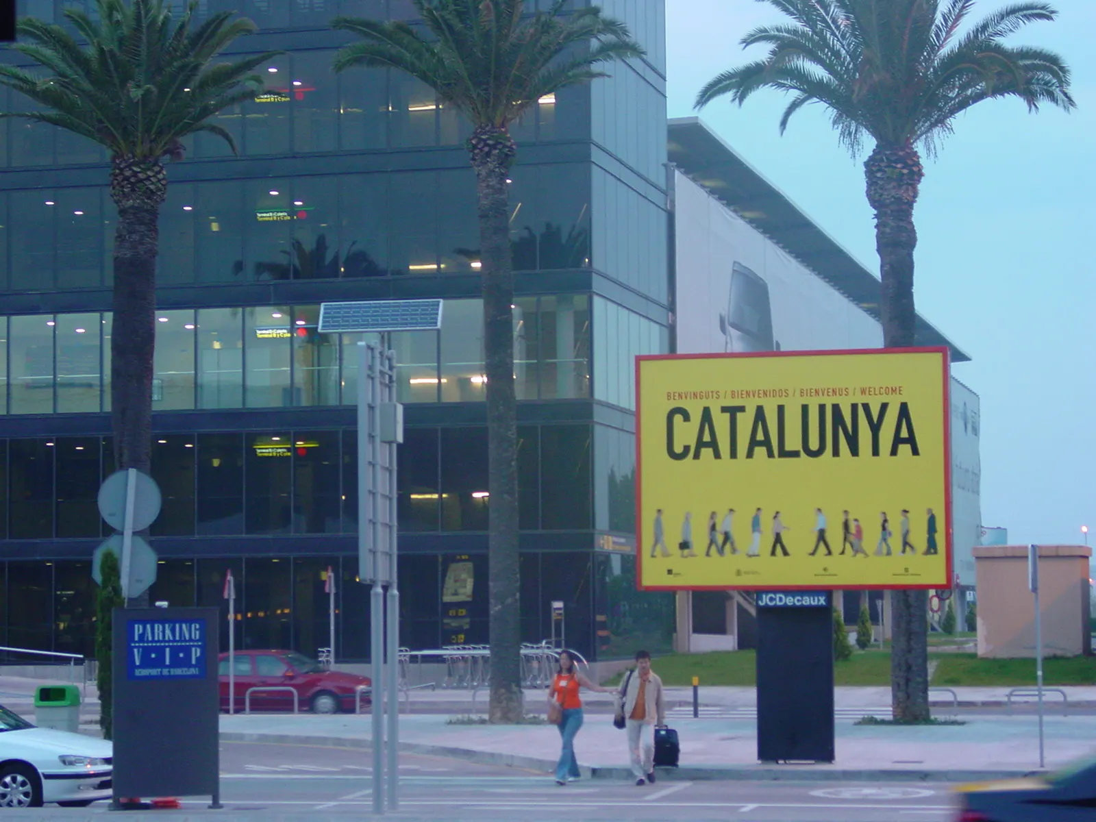 Large welcome sign reading Barcelona Airport Catalonia in the arrivals area of Barcelona-El Prat.