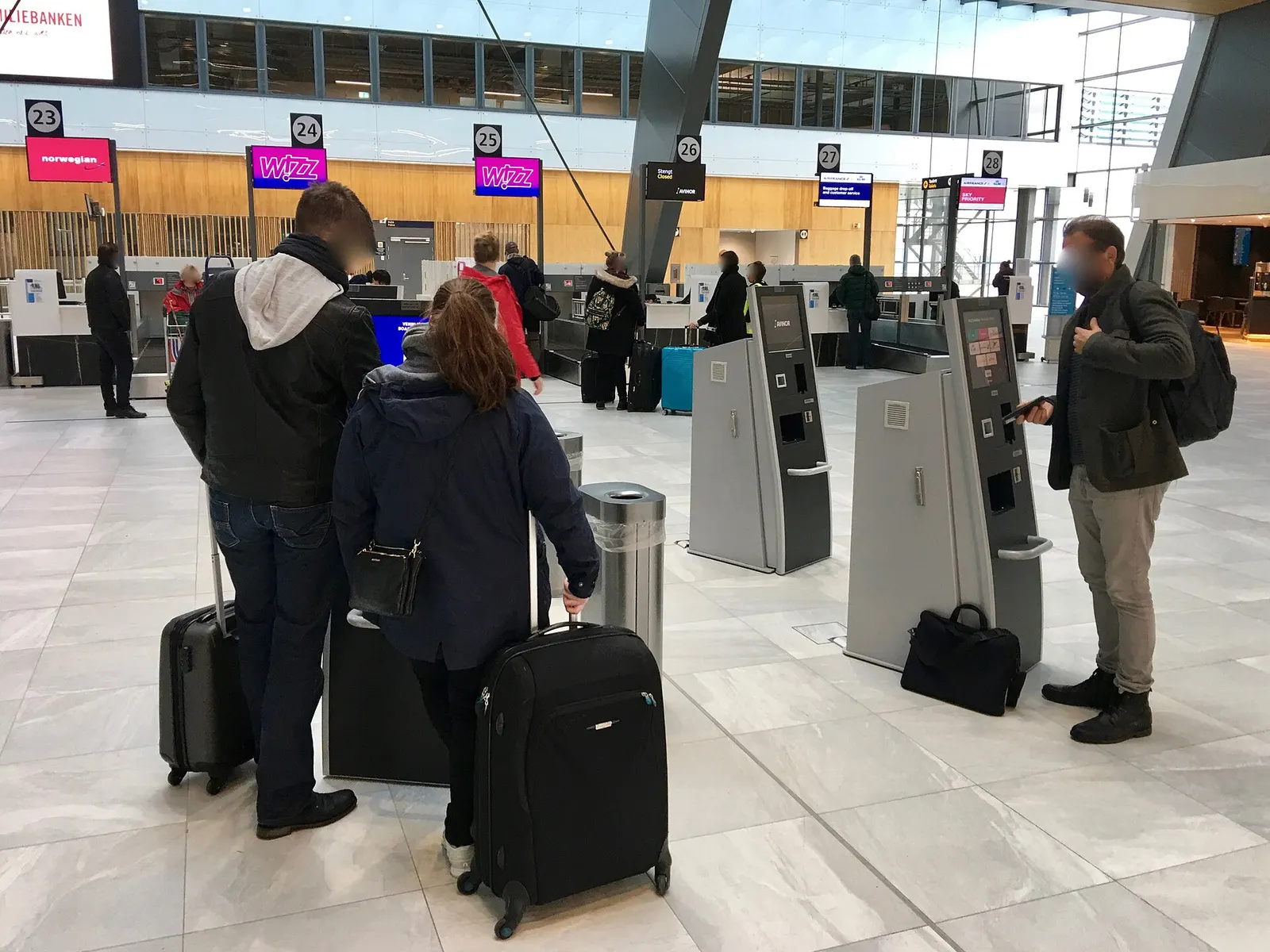 Bergen Airport, BGO (Bergen Lufthavn, Flesland) – Terminal 3 (opened 2017) – self-service check-in machines in departure/check-in area ( automater for innsjekking og uskrift av ombordstigningskort og bagasjelapp i avgangshallen ). Bergen, Norway, October 2017.
