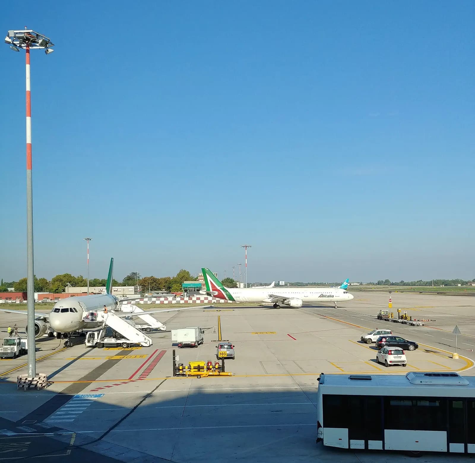 Apron and aircraft viewed from the Bologna Airport passenger terminal