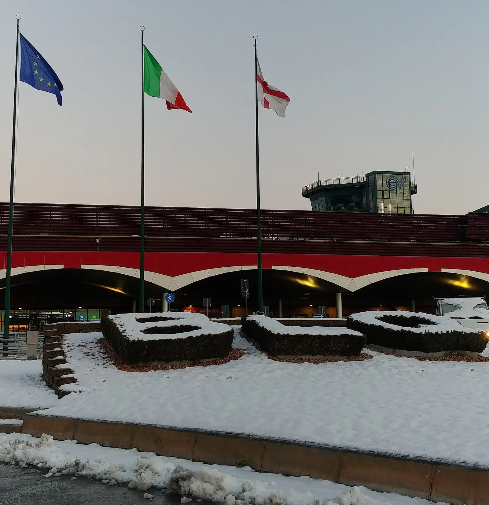 Upper-floor landside view inside Bologna Marconi passenger terminal