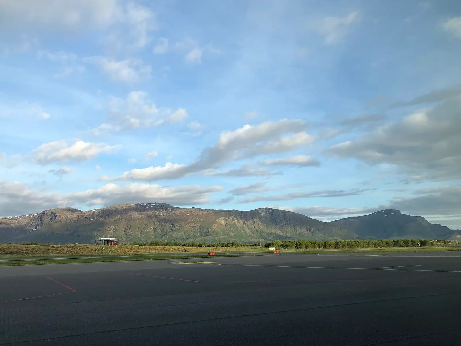 Brønnøysund Airport buildings and parking from landside in 2019