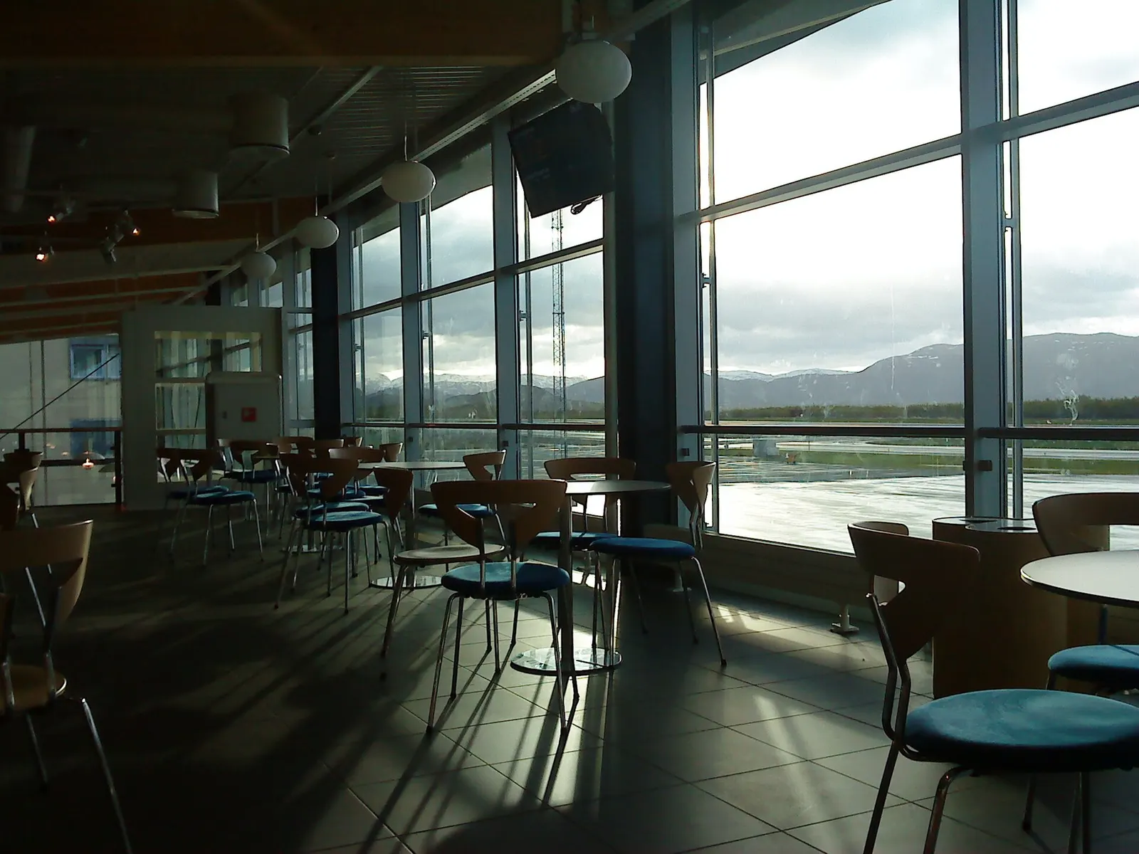 Check-in hall interior at Brønnøysund Airport with desks and departure screens