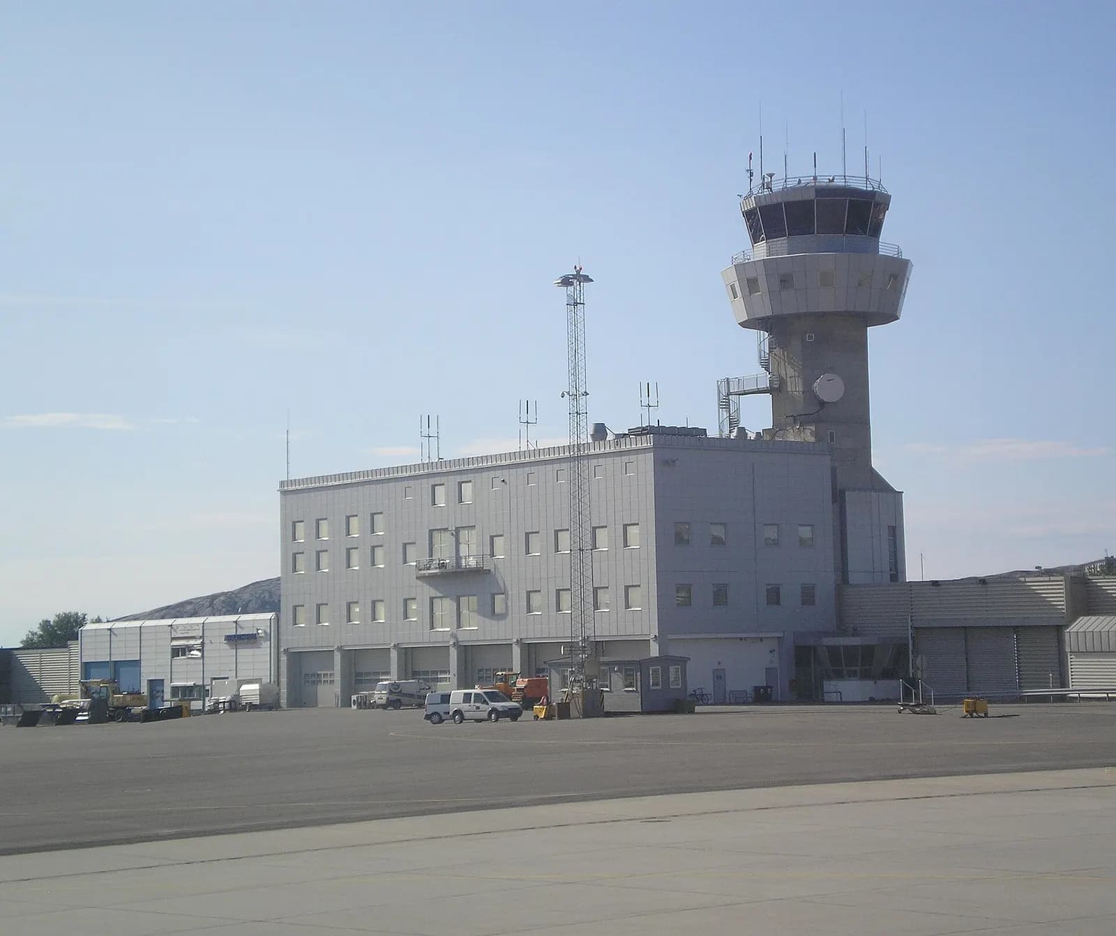 Bodø Airport passenger terminal façade under northern sky.
