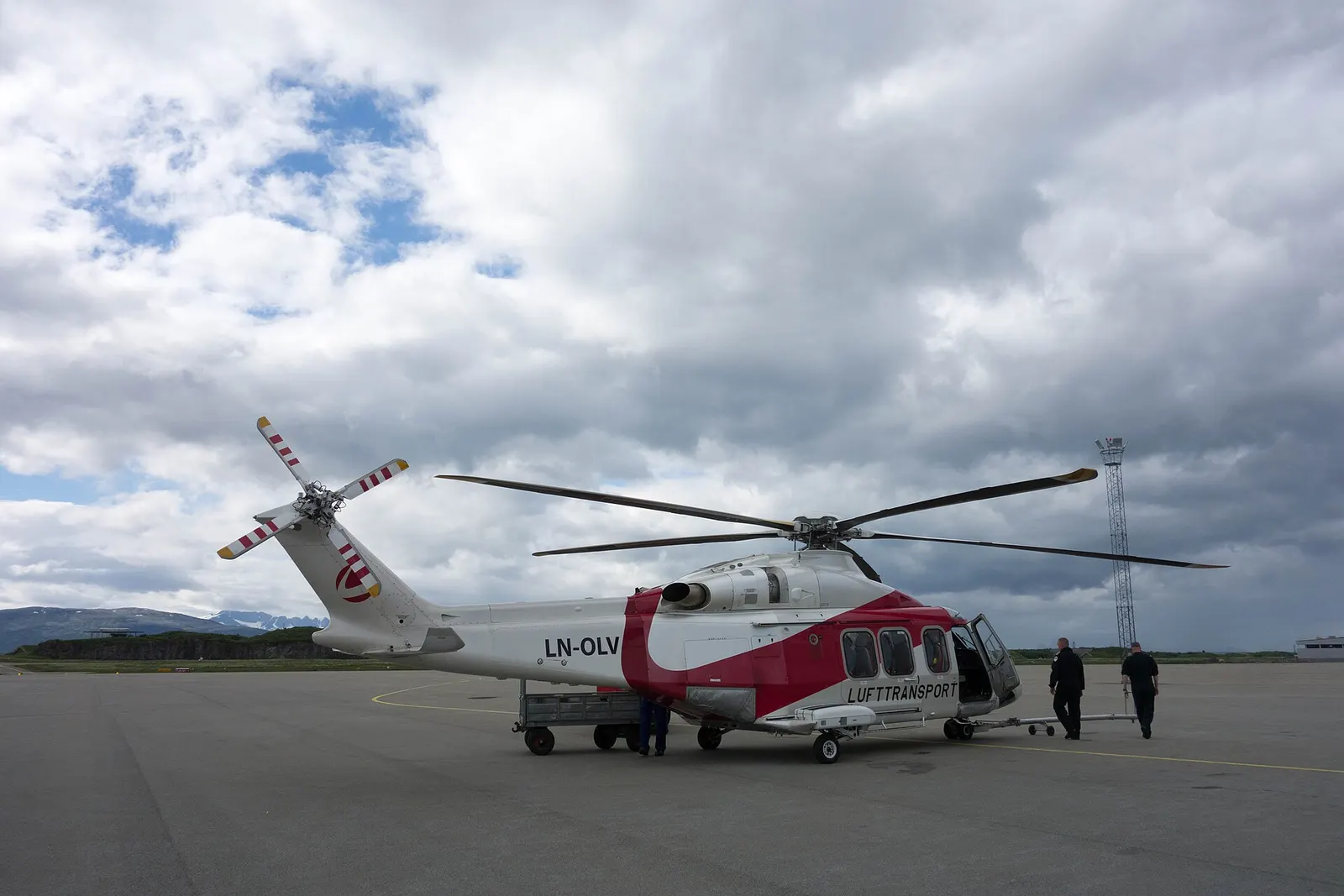 Bodø Airport terminal and airside area photographed in summer daylight.