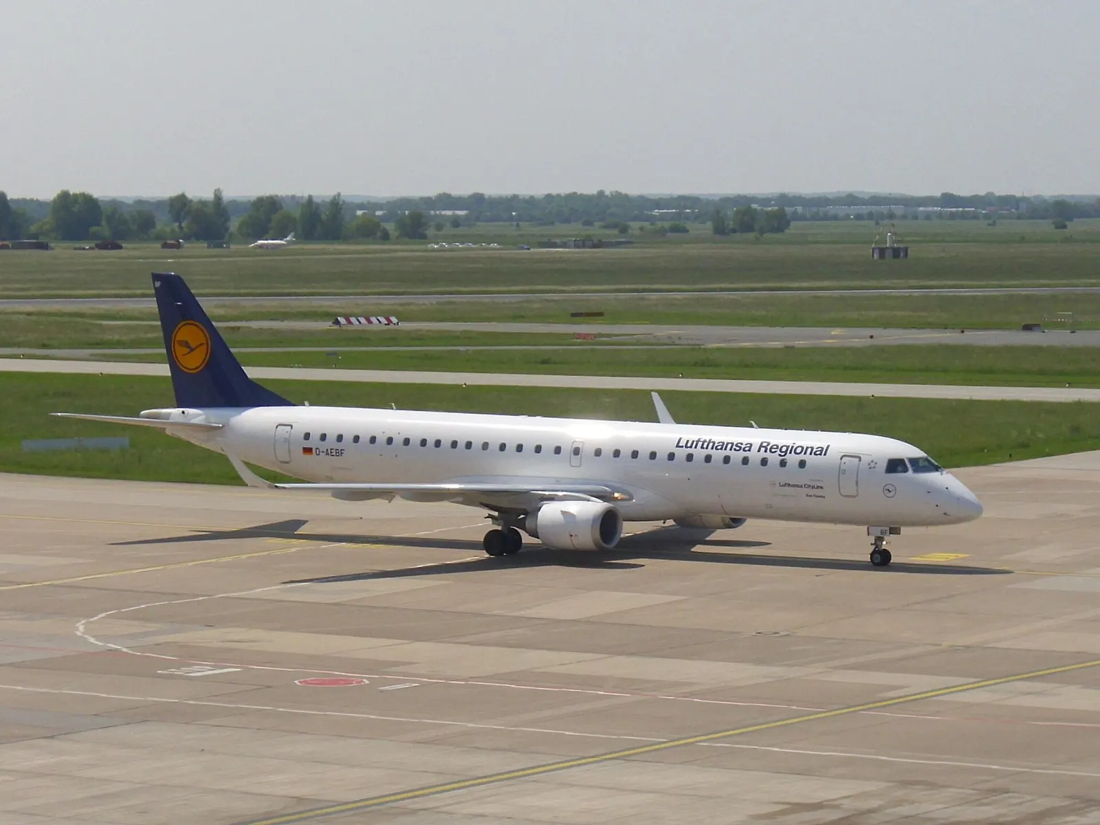 An Enbraer 195 of Lufthansa Regional with registration D-AEBF at the airport of Bremen