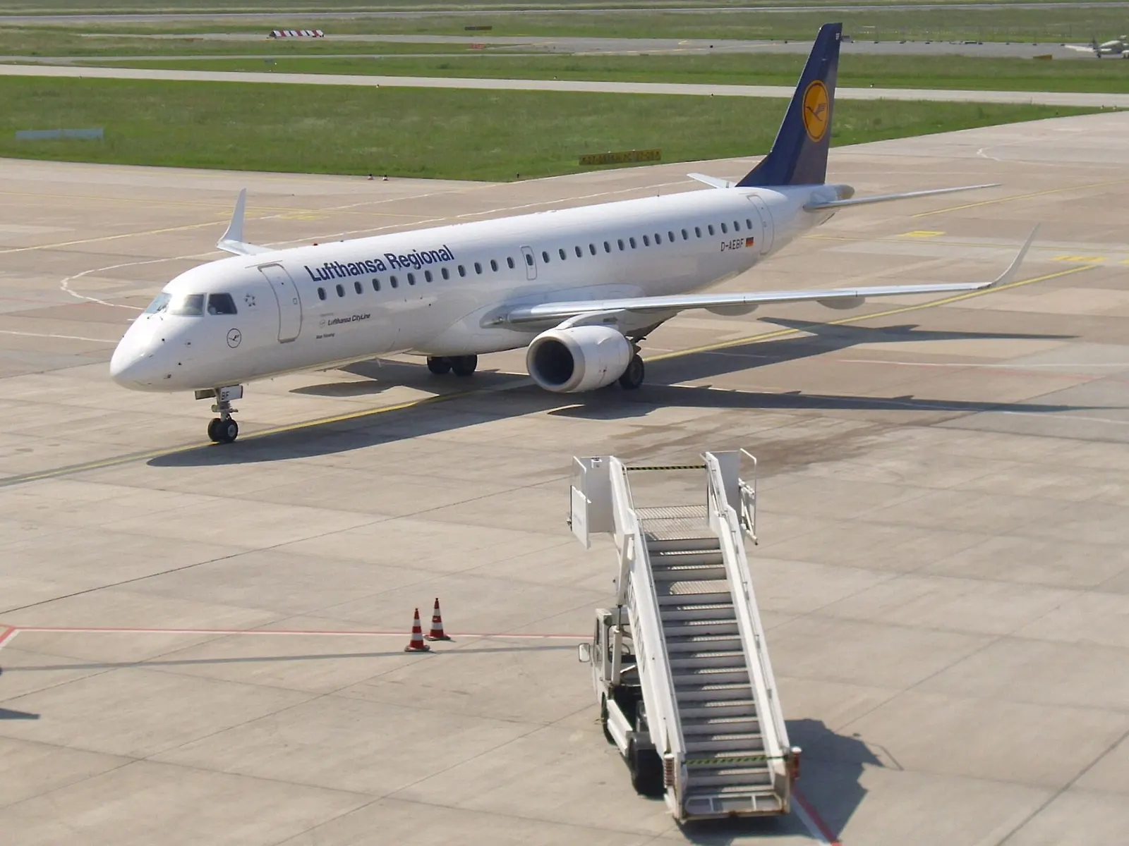 An Enbraer 195 of Lufthansa Regional with registration D-AEBF at the airport of Bremen