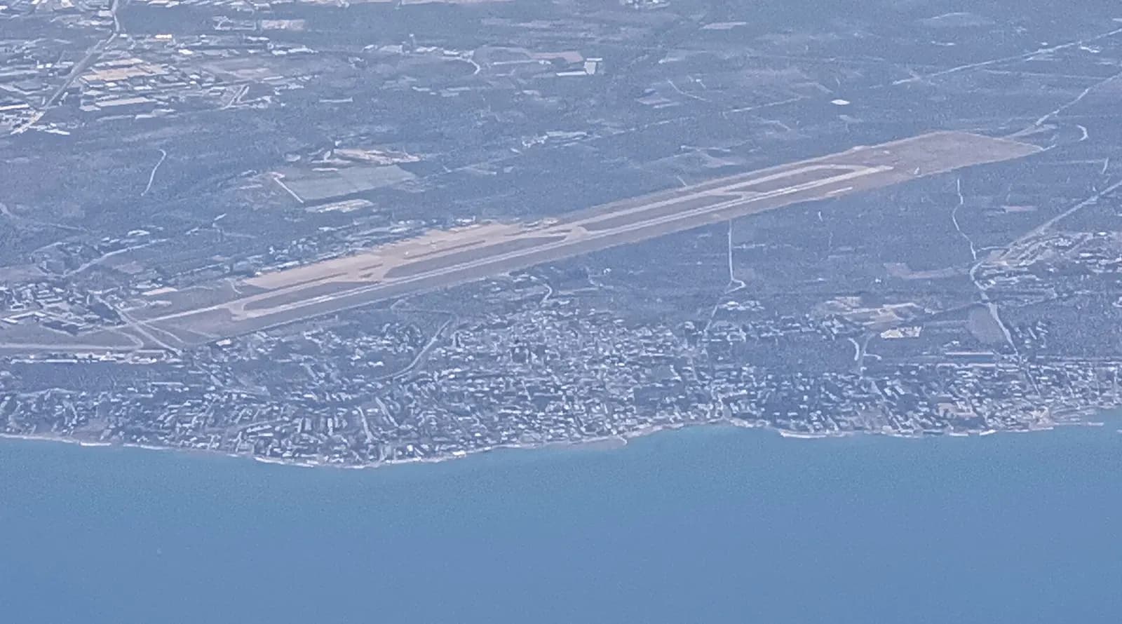 Bari Airport runway and terminal complex photographed from an aircraft