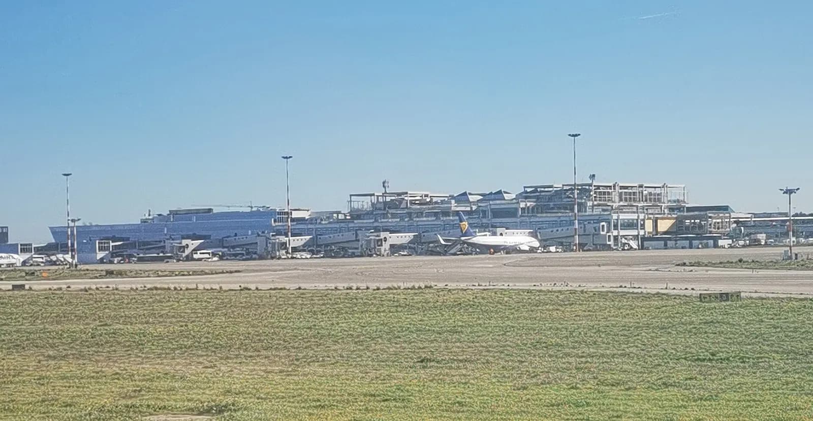 Bari Karol Wojtyła Airport terminal exterior and forecourt in December 2023