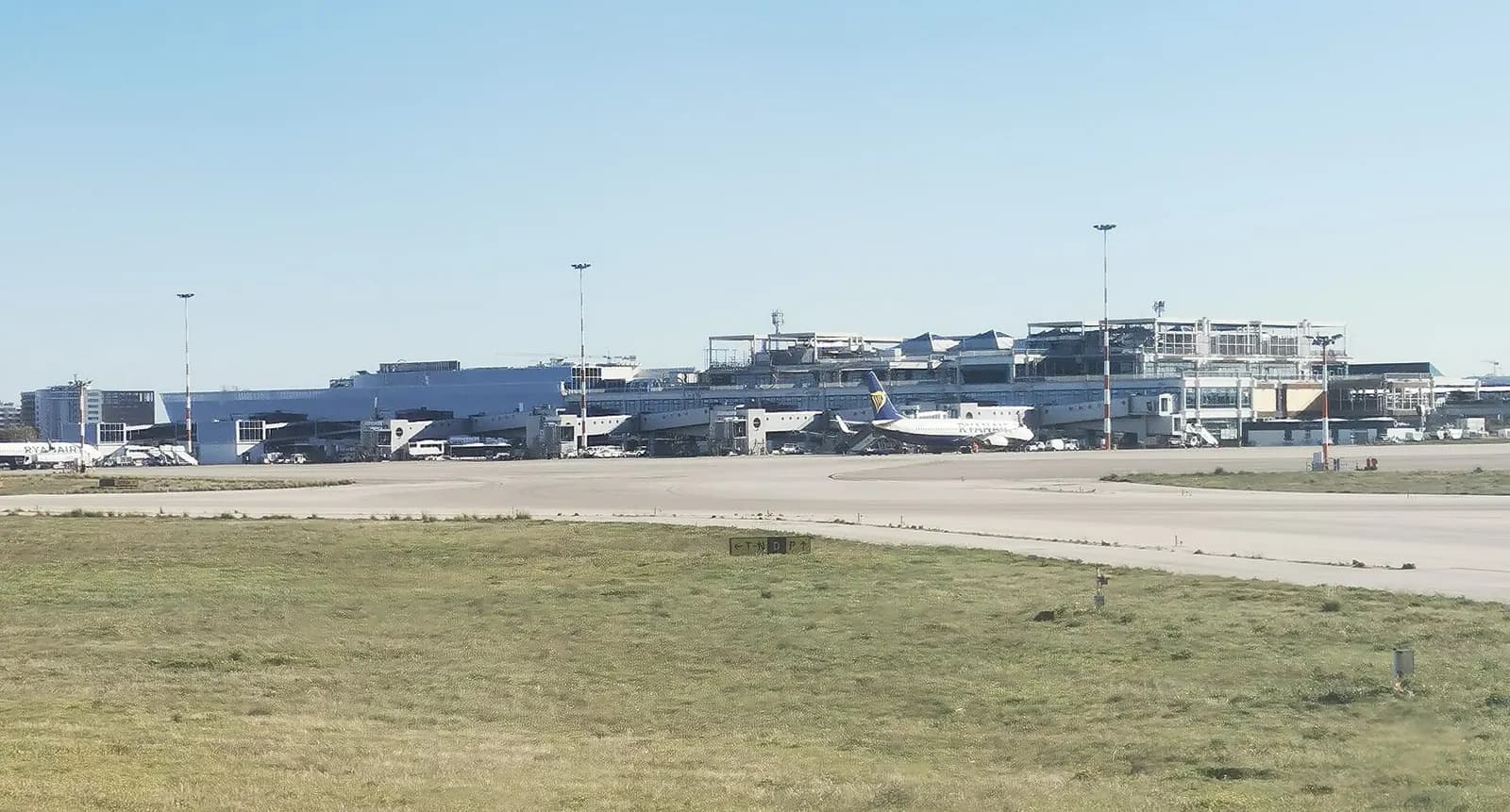 Bari Airport passenger terminal façade and approach road in December 2023