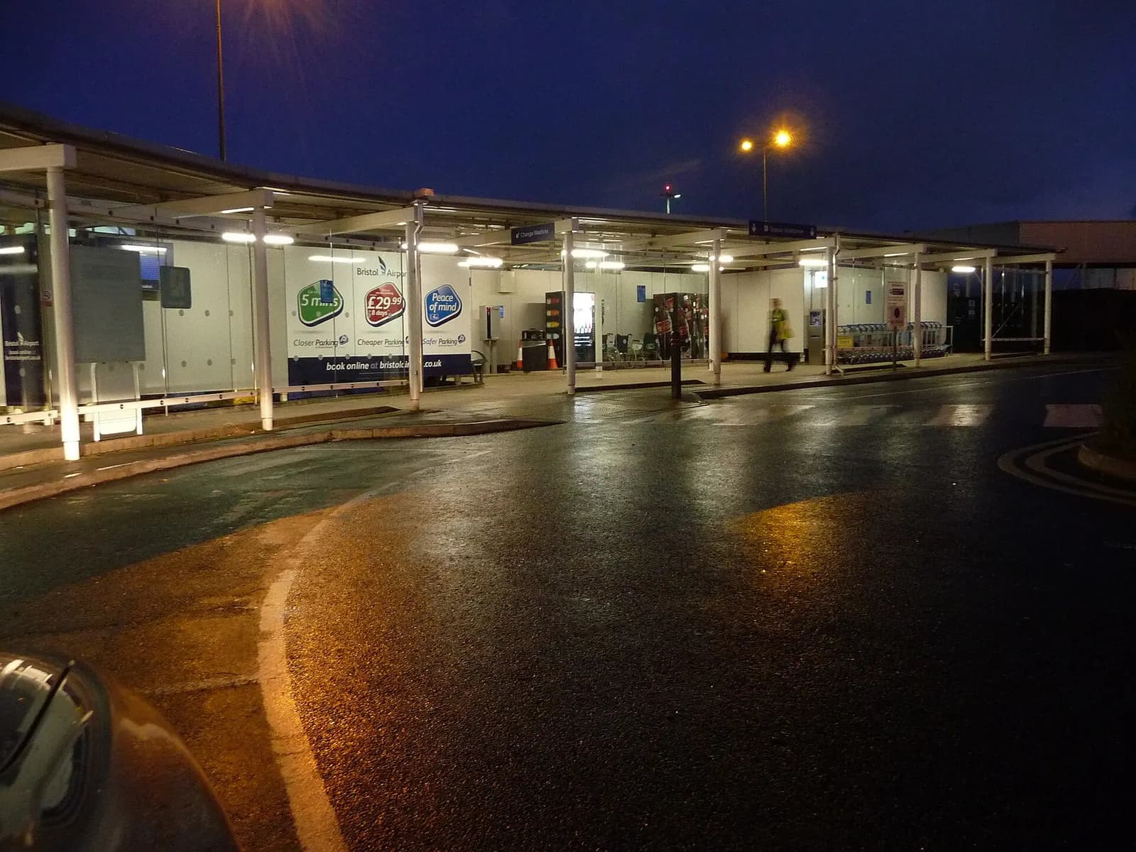 Signed drop-off and pick-up point kerb outside Bristol Airport terminal