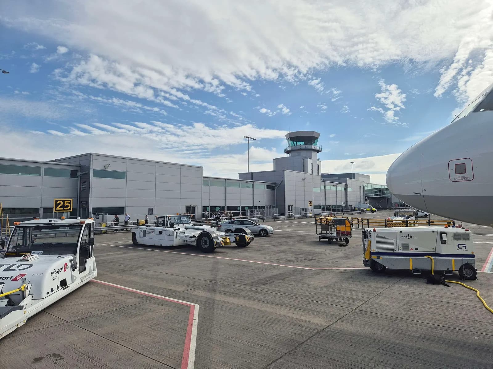 Bristol Airport main terminal facade and control tower from the southern approach in June 2025