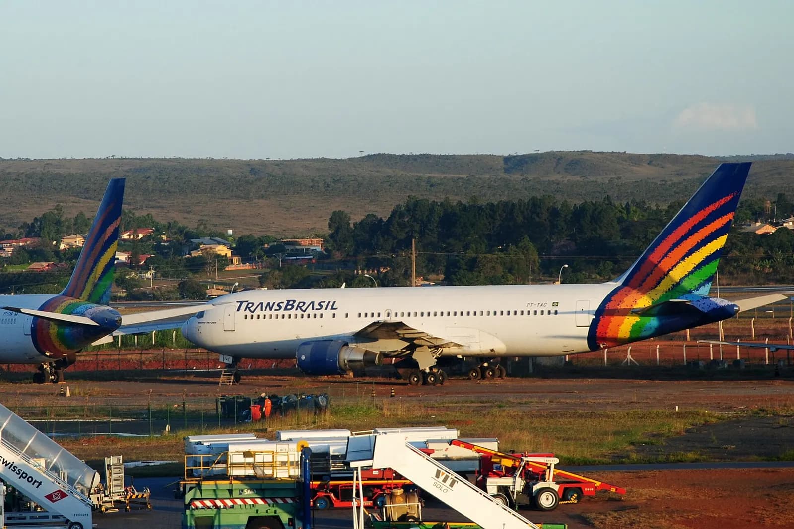 Transbrasil was a worldwide Brazilian airline. Its operation stopped in December 2001. The company was well-known for its colorful airplane which created a rainbow on the tail of aircraft. It was operated in Brasilia International Airport (BSB).