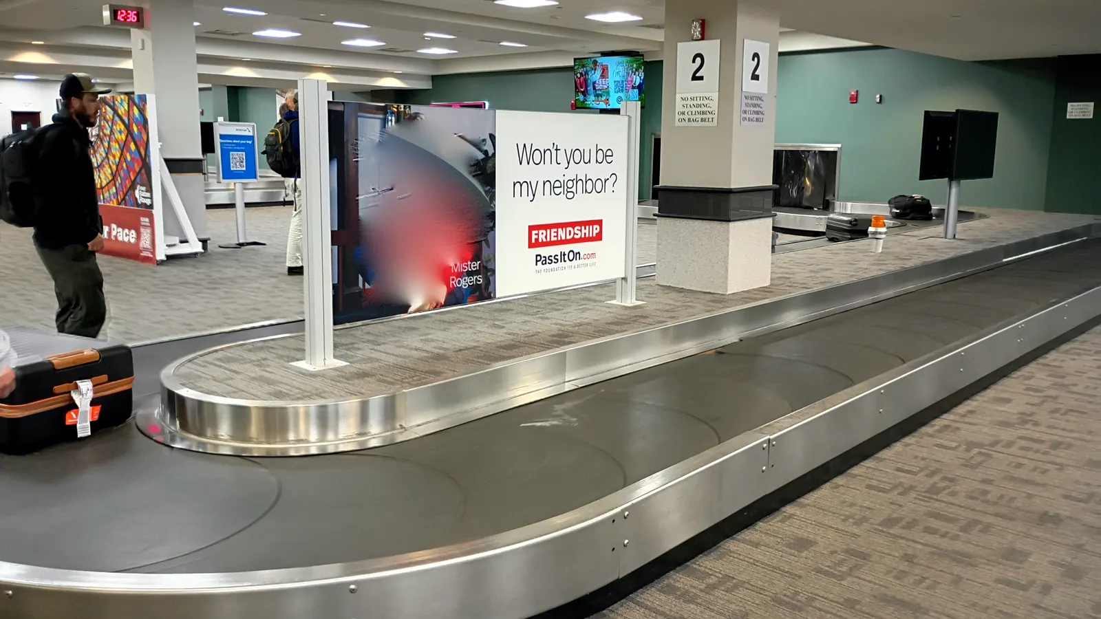 May 2026 baggage-claim hall at Baton Rouge Metropolitan Airport with carousels and seating.
