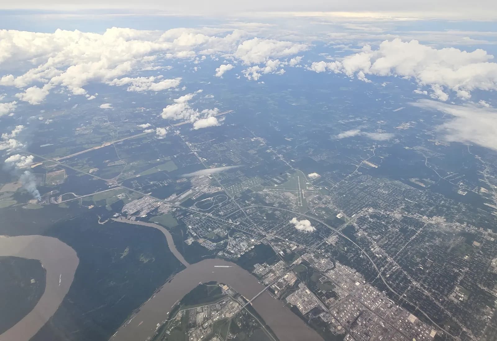May 2026 aerial of Baton Rouge Metropolitan Airport north of downtown with the Mississippi River beyond.