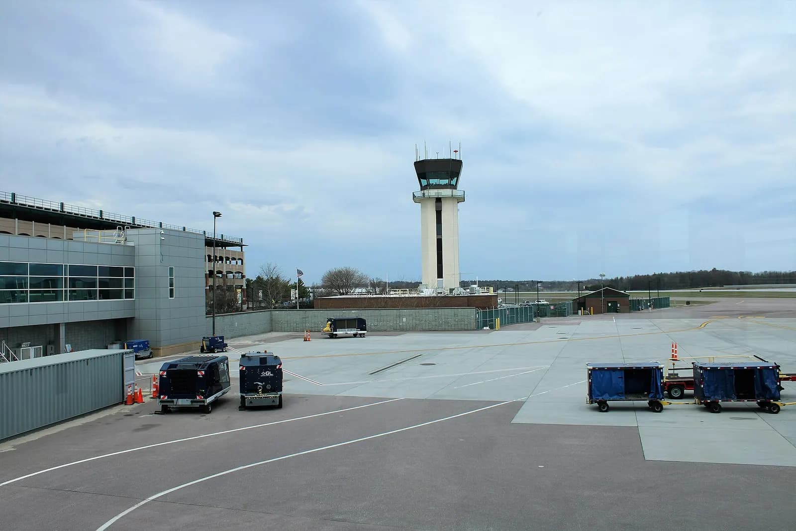 Civil air traffic control tower beside the passenger terminal at Burlington International Airport.