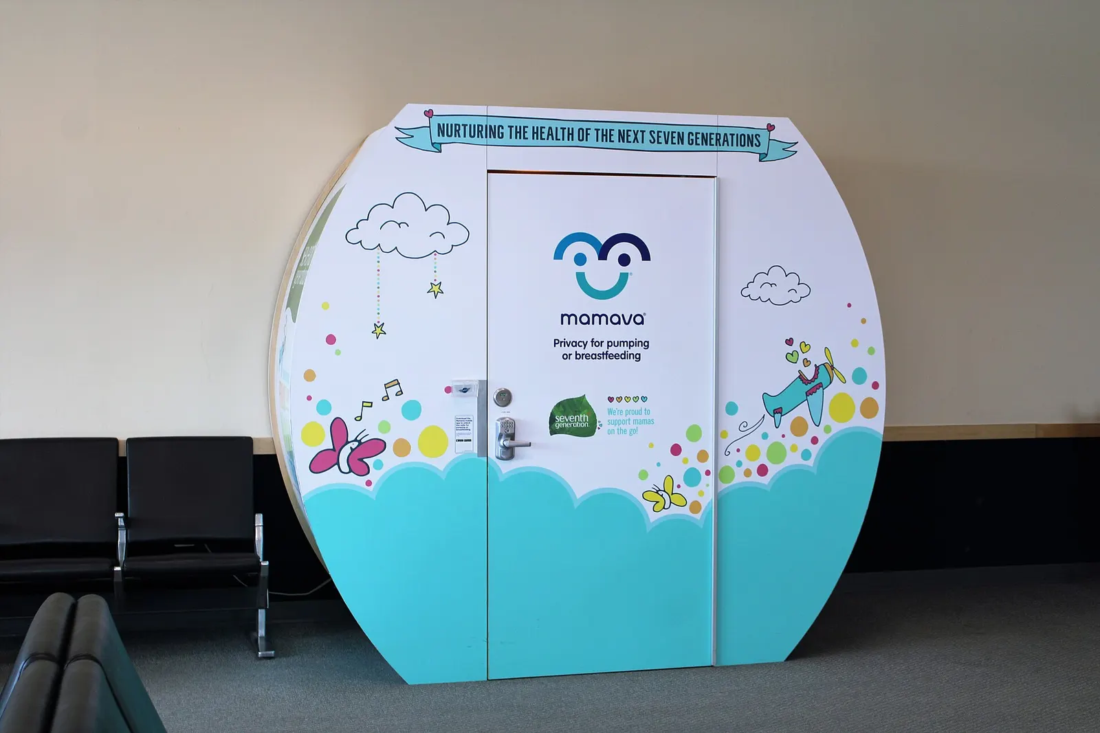 Mamava lactation pod against a holdroom wall at Burlington International Airport.