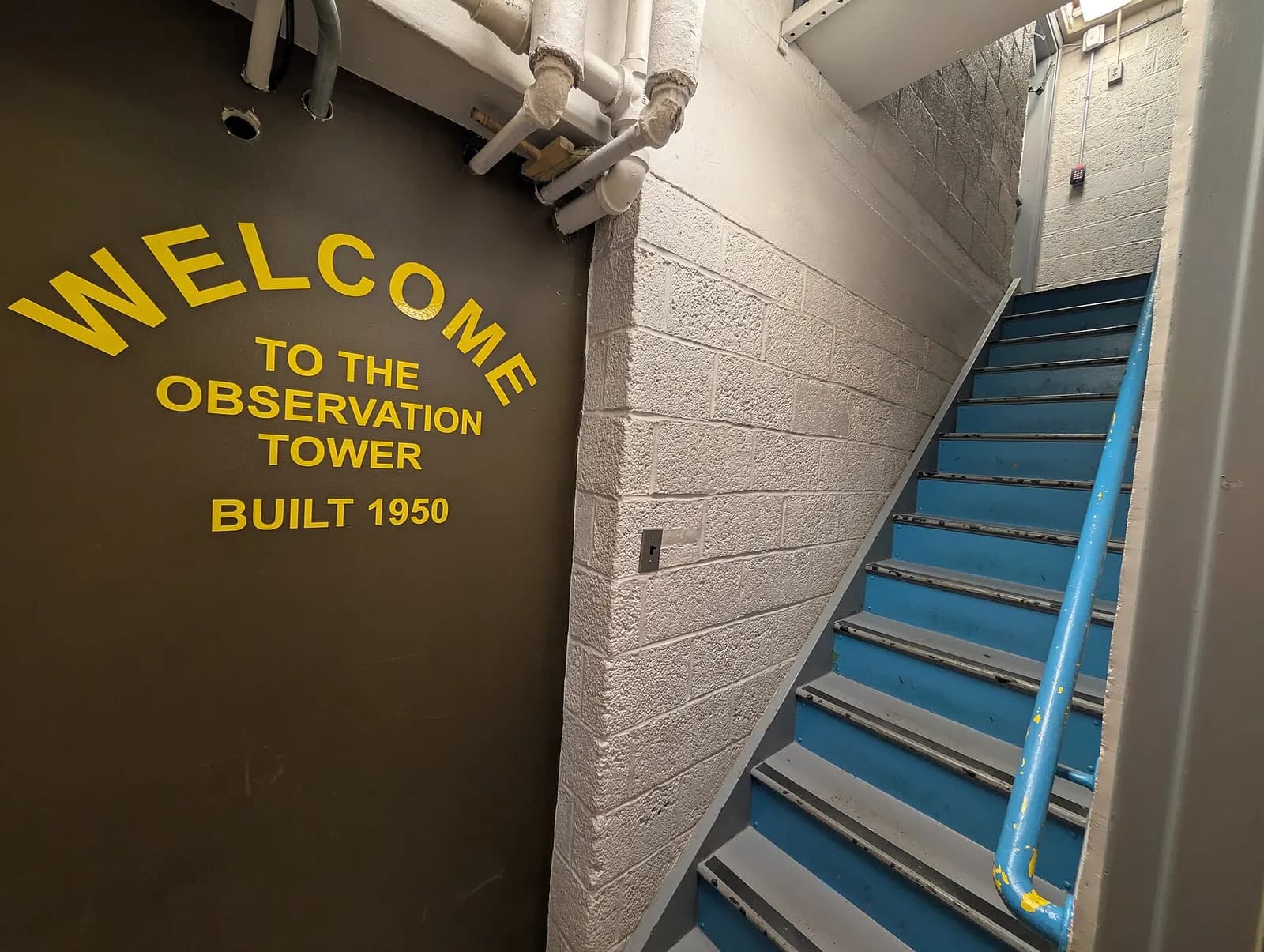 Narrow stairwell entrance to the unused 1950s observation tower at Patrick Leahy Burlington International Airport.
