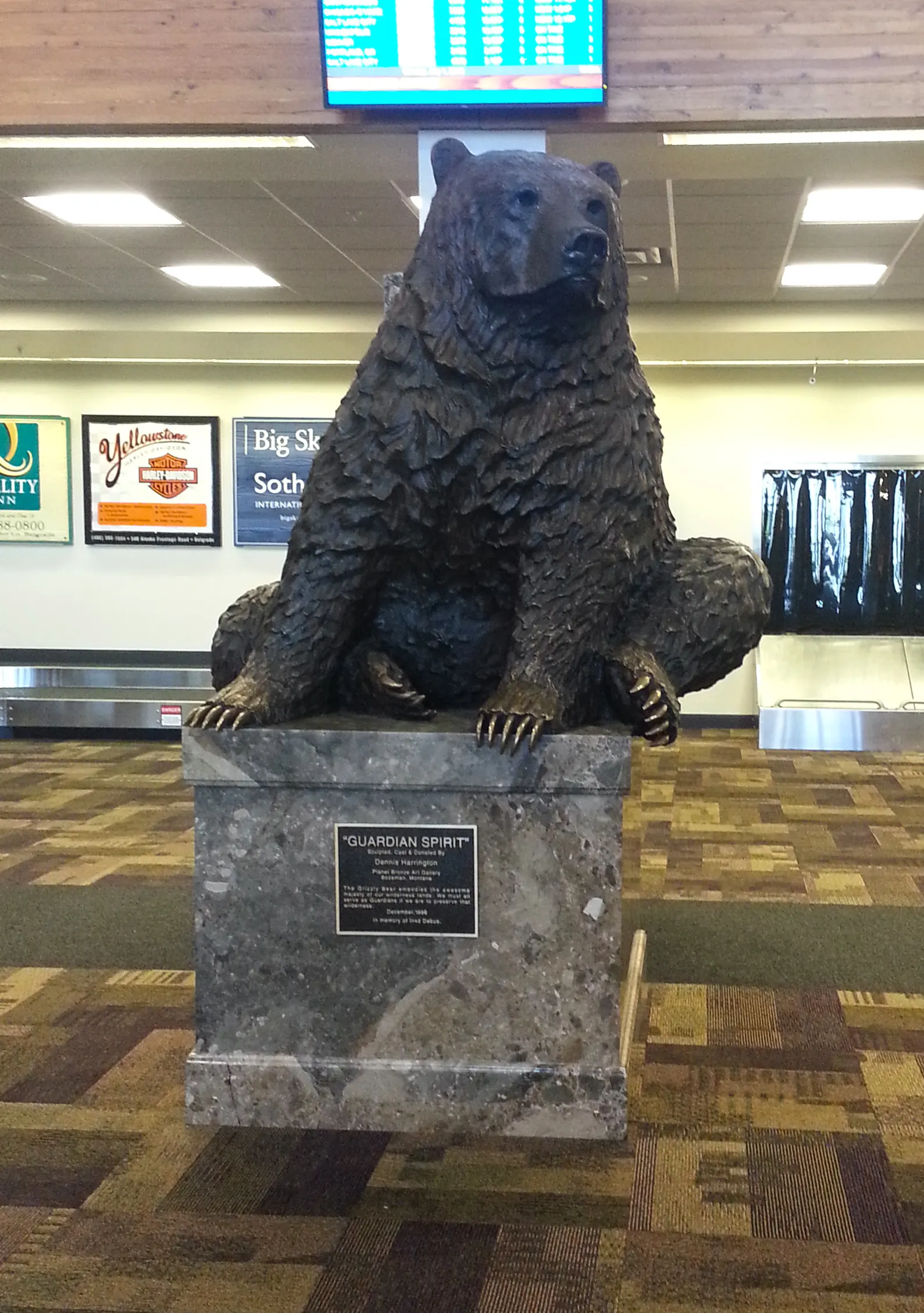 Bronze grizzly bear statue inside Bozeman Yellowstone International Airport.