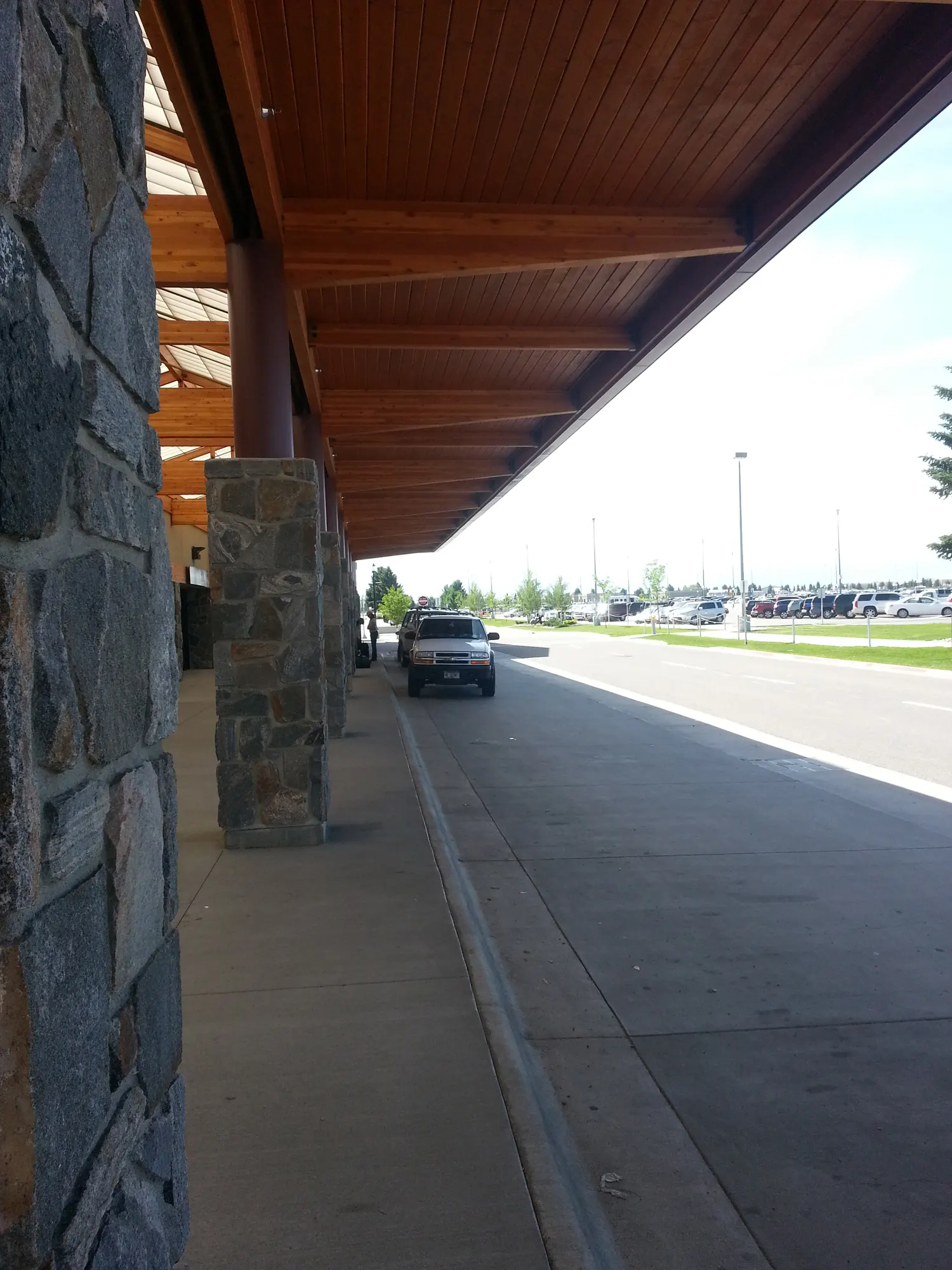 2013 taxi-stand sign on the curb at Bozeman Yellowstone International Airport.