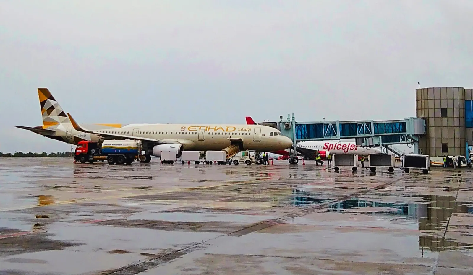 Etihad Airways aircraft on the wet apron at Calicut International Airport