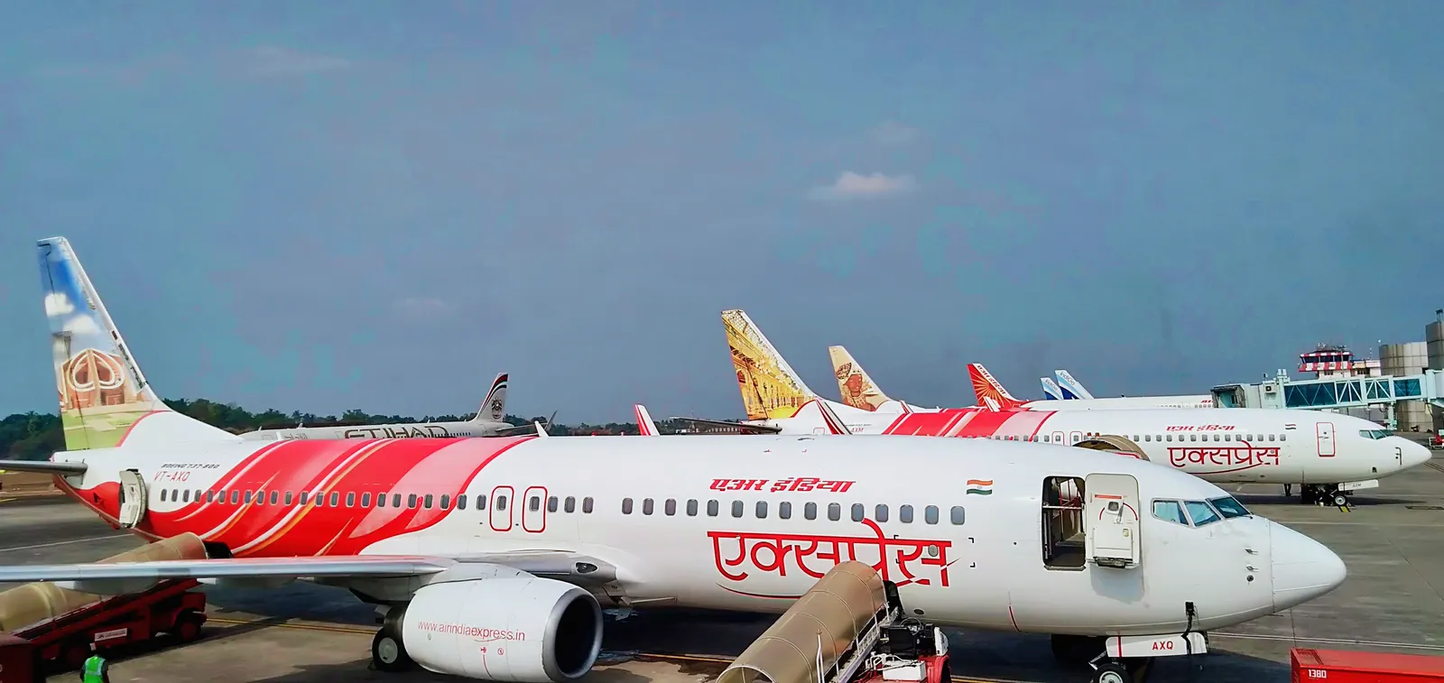 Air India Express Boeing 737s and an Etihad jet on the Calicut apron