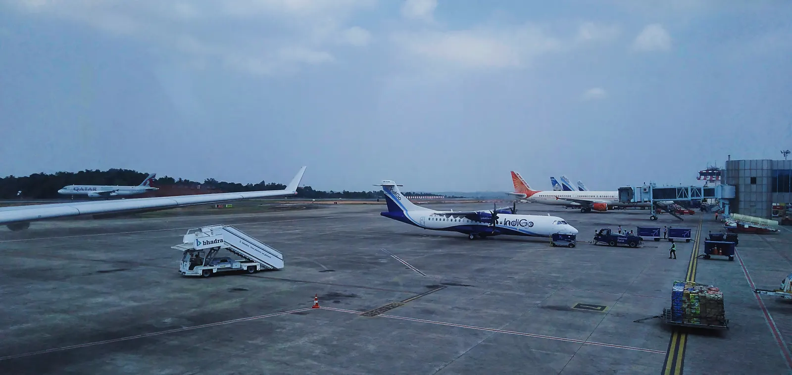 Apron view at Calicut International Airport with IndiGo ATR and jet bridges
