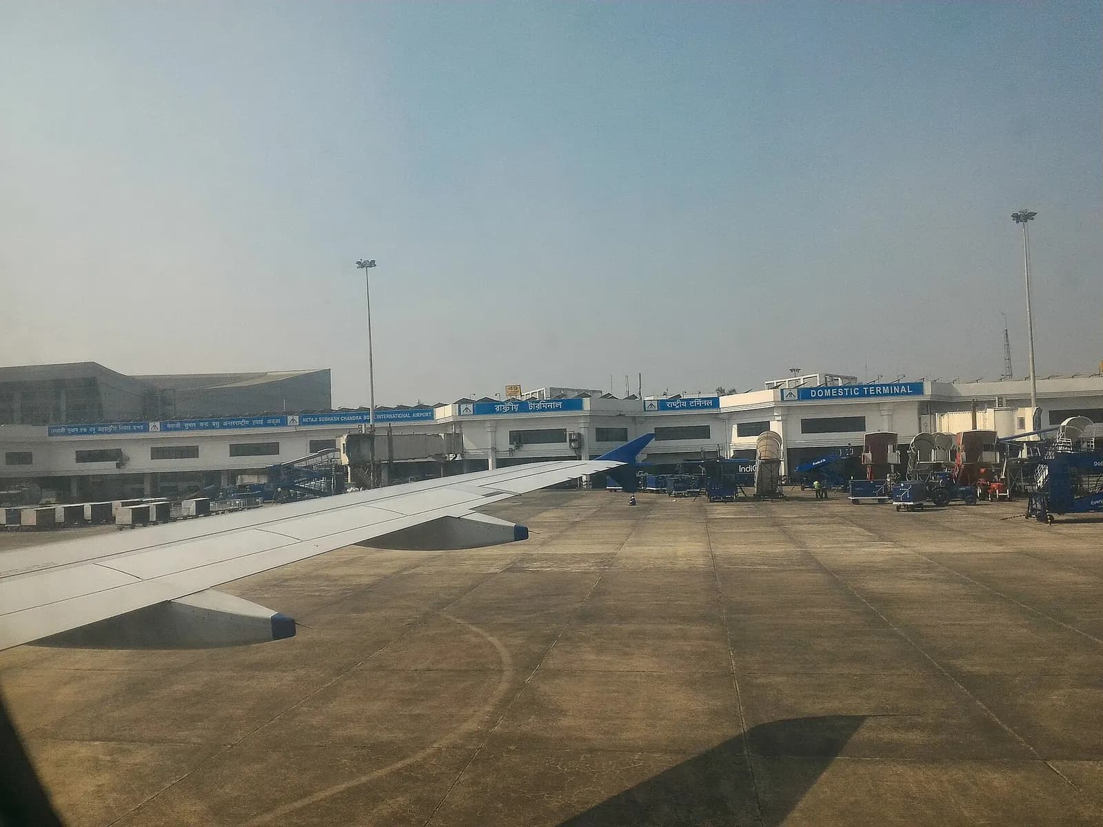 The domestic terminal of Netaji Subhash Chandra Bose International Airport, Kolkata shot from a landing flight.