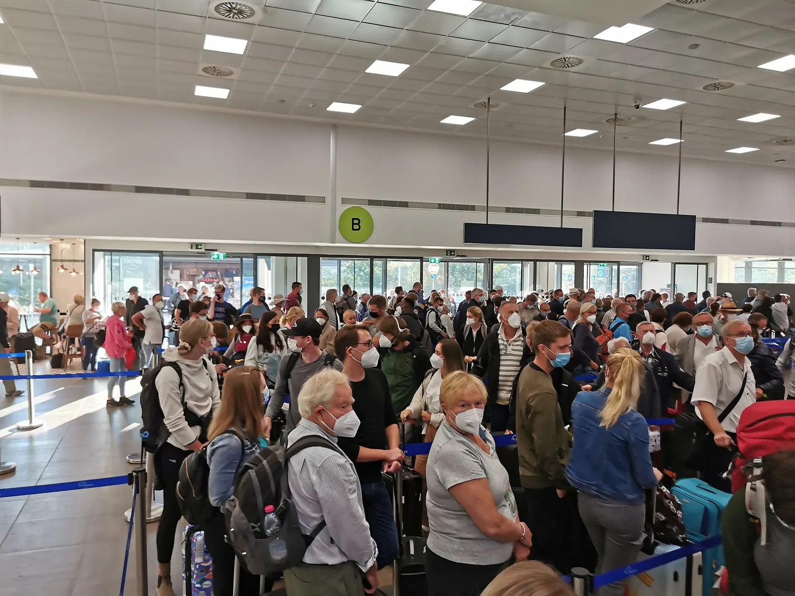Passengers waiting in the check-in queue maze at Corfu Airport