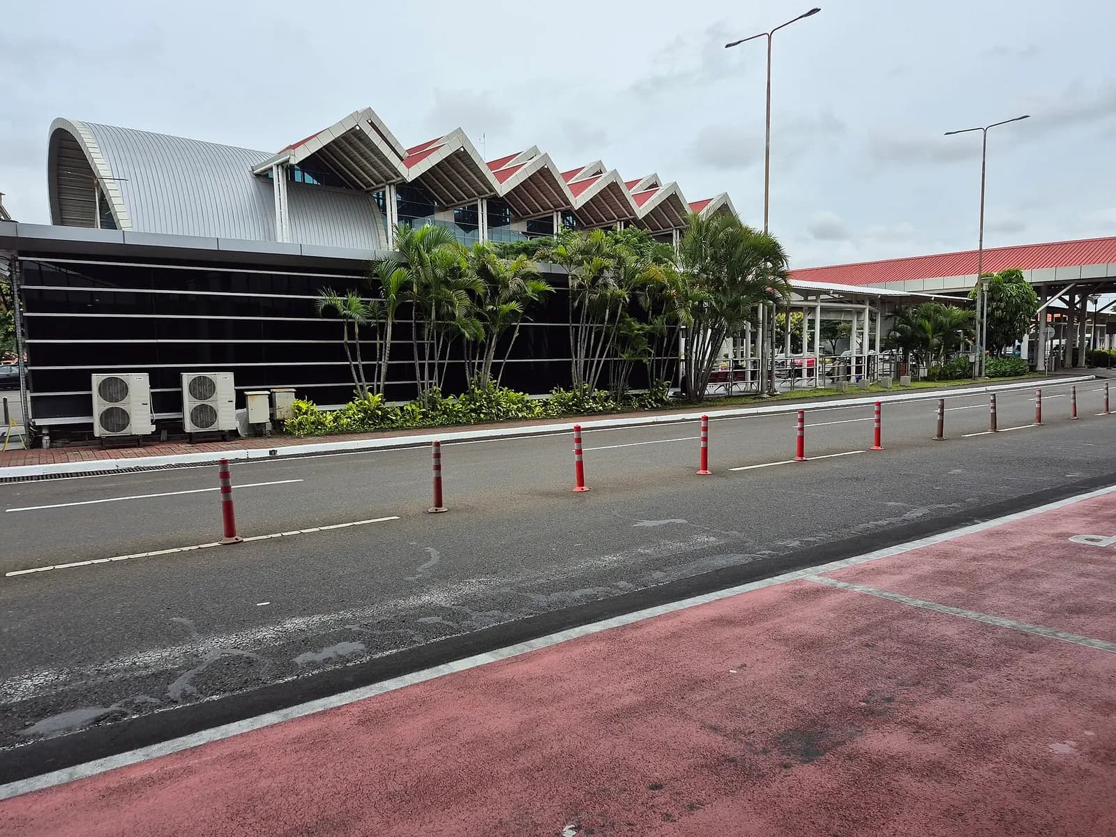 Covered Kalayang skytrain shelter at Terminal 1 in January 2025, with platform barriers, signage, and the automated people-mover track.