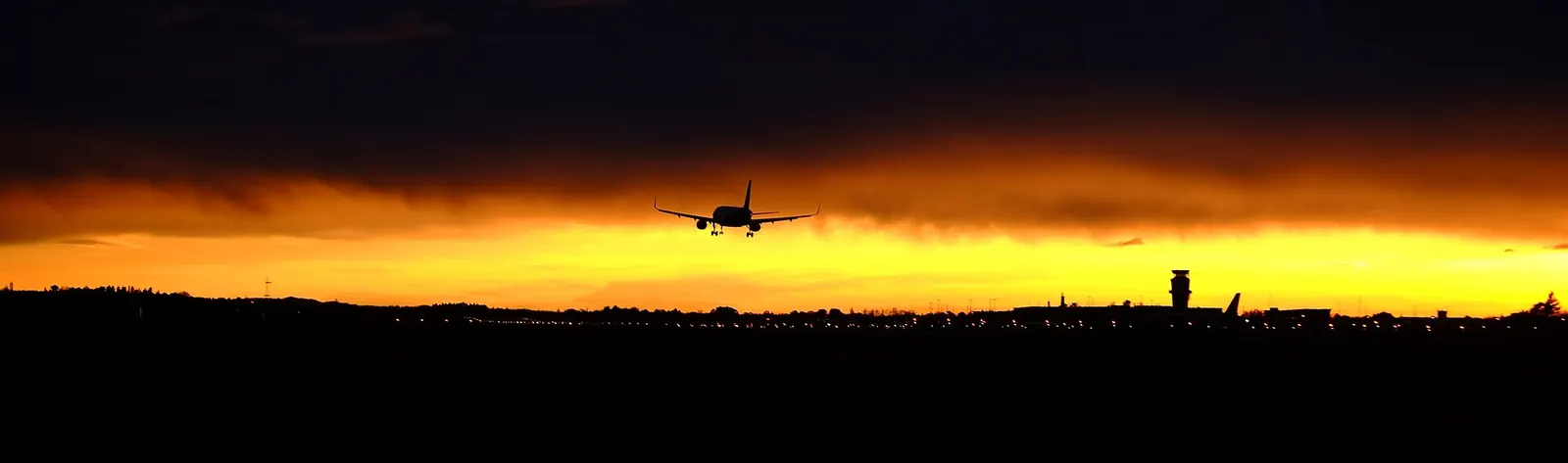 Christchurch International Airport terminal exterior at sunrise