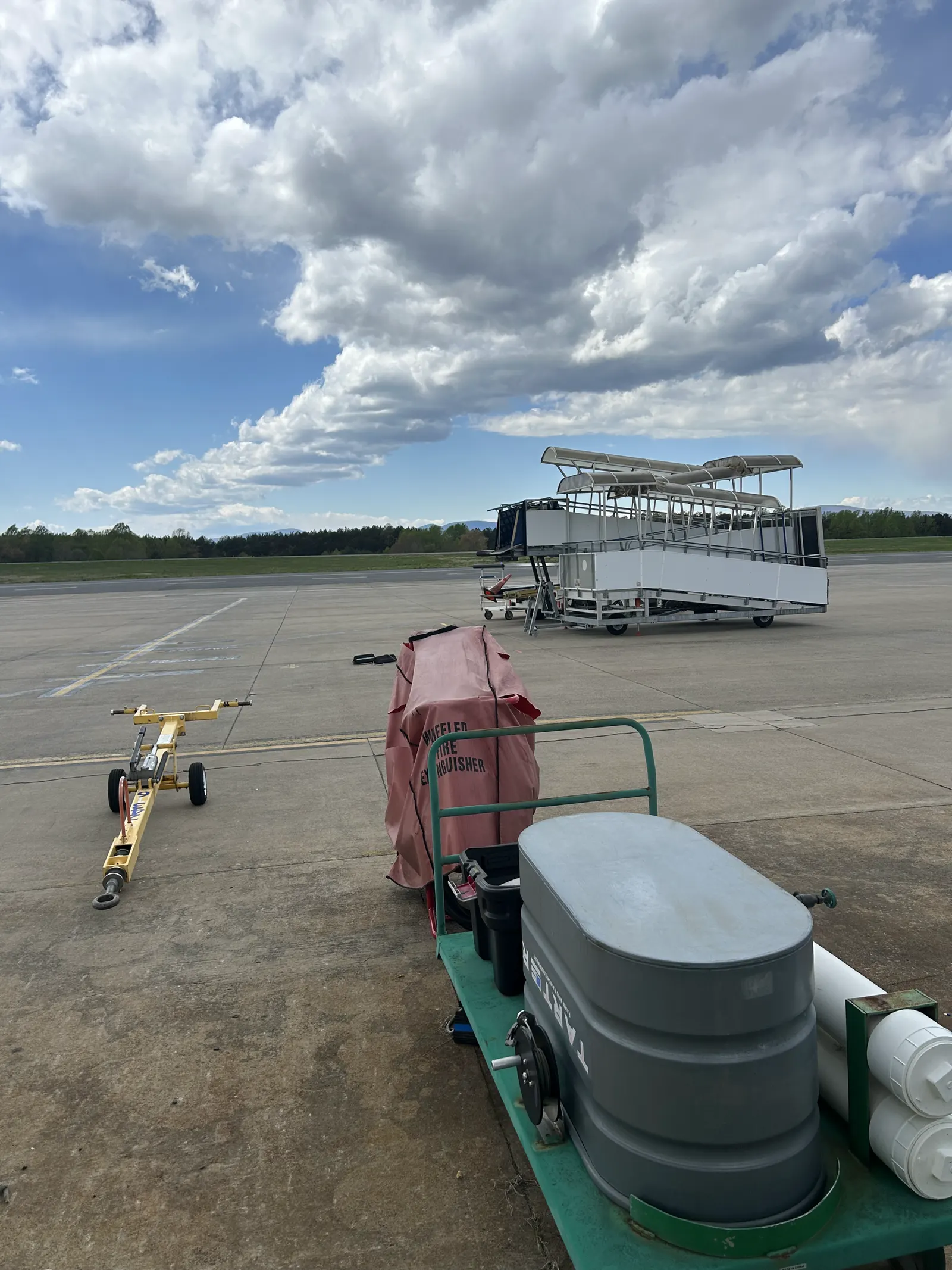 CHO airside ramp with tow bar and white pavement markings