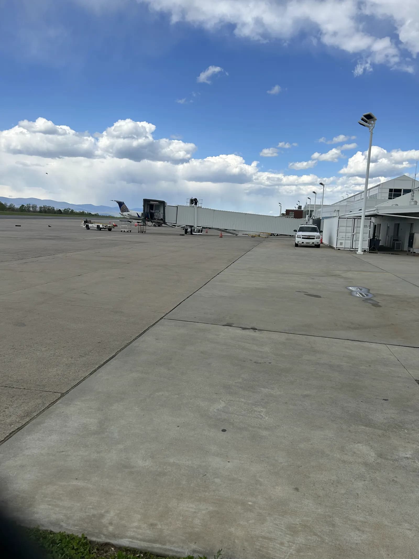 CHO ramp and white terminal building from the airside concrete