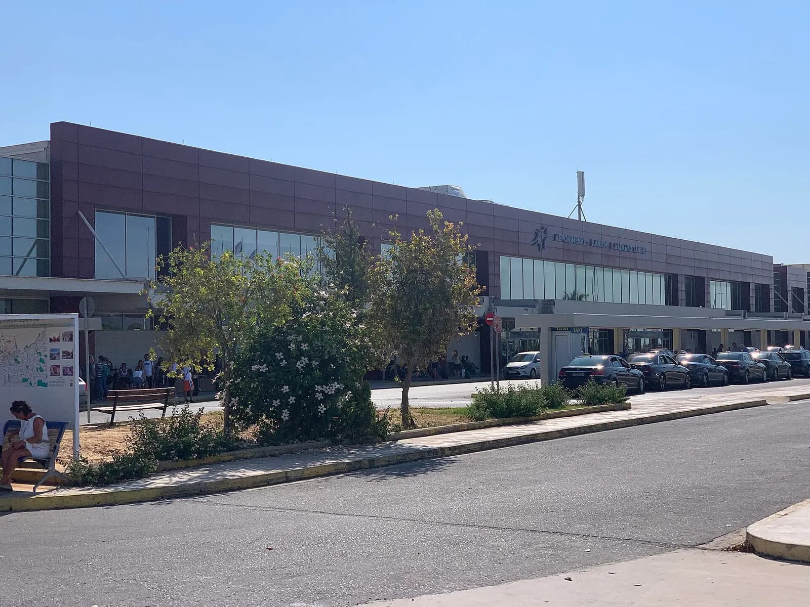 Landside exterior of Chania International Airport terminal in July 2021.