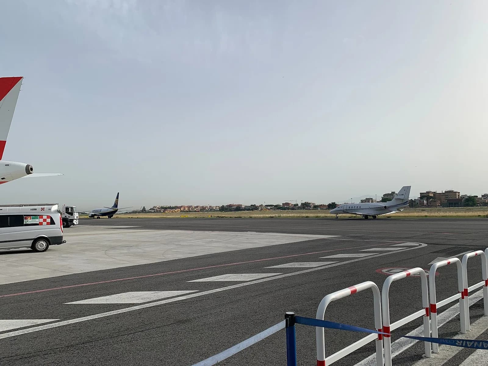 Ciampino apron with ADR vehicles and nearby housing