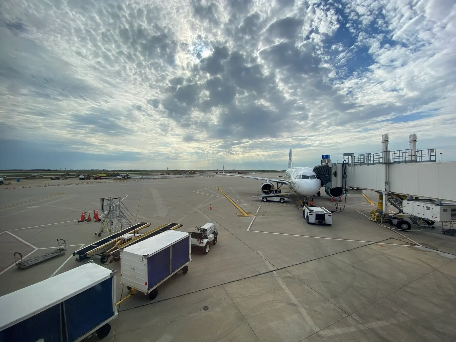 Ramp view from Gate 9 at CID in September 2021, with a Frontier aircraft and apron construction.